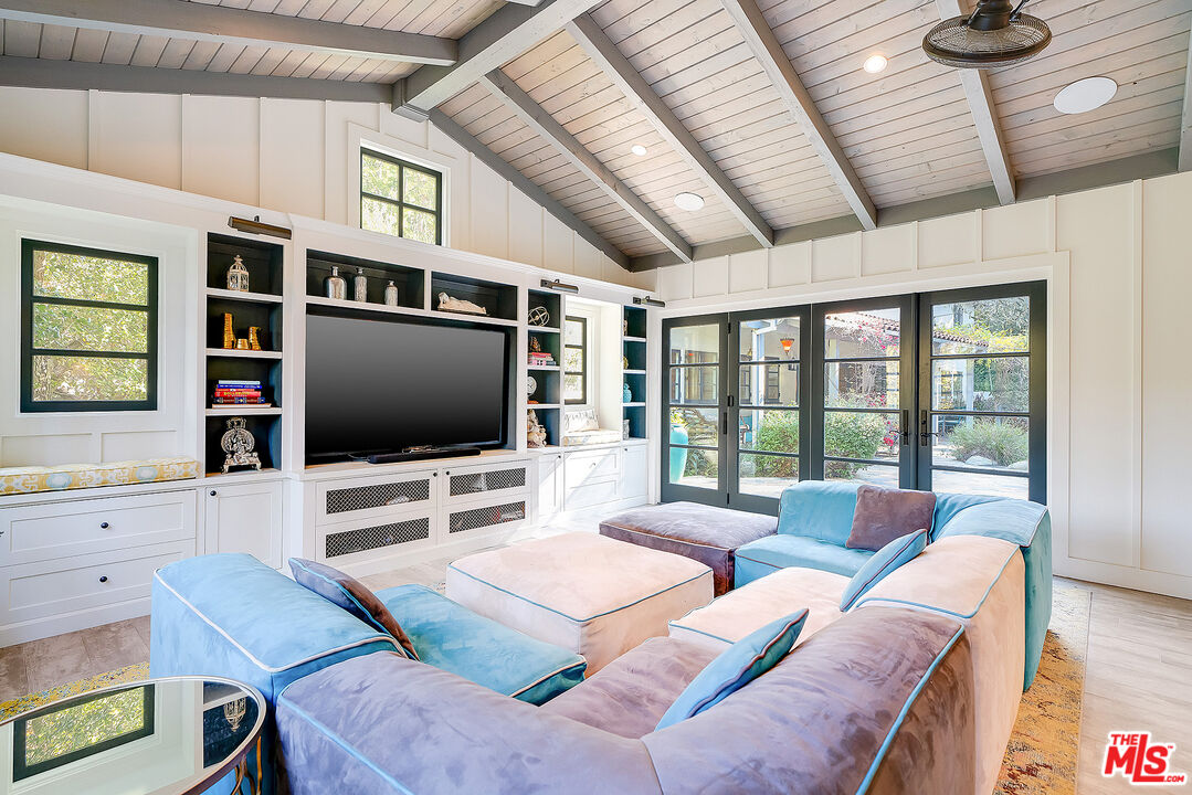 11670 Duque Drive Studio City, CA 91604 - Photo 34 of 48 a living room with furniture and a flat screen tv