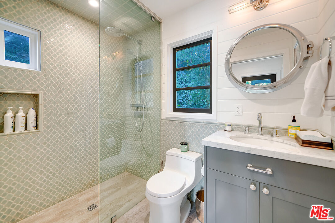 11670 Duque Drive Studio City, CA 91604 - Photo 40 of 48 a bathroom with a toilet sink and mirror