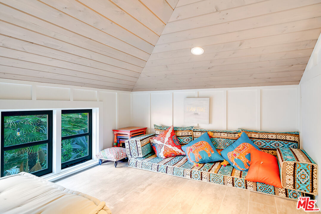 11670 Duque Drive Studio City, CA 91604 - Photo 41 of 48 a bedroom with a bed and a painting on the wall