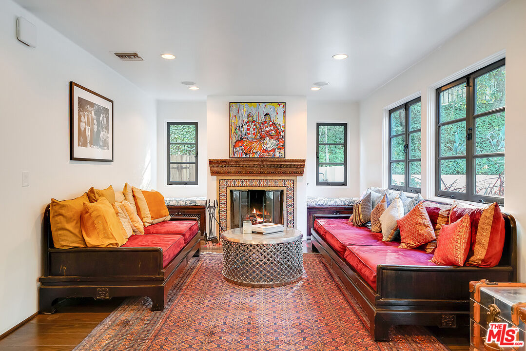11670 Duque Drive Studio City, CA 91604 - Photo 9 of 48 a living room with furniture fireplace and window