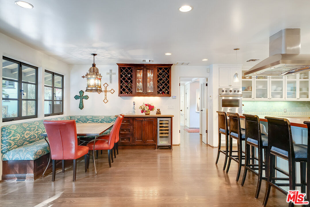 11670 Duque Drive Studio City, CA 91604 - Photo 10 of 48 a view of a dining room with furniture and wooden floor