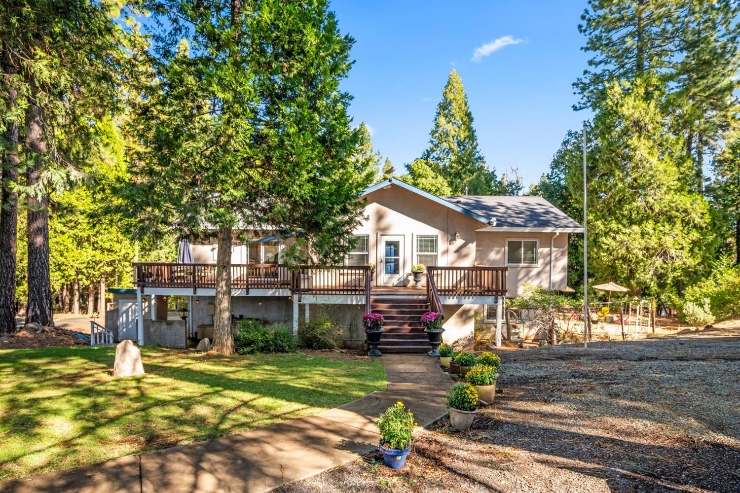 a front view of a house with a garden