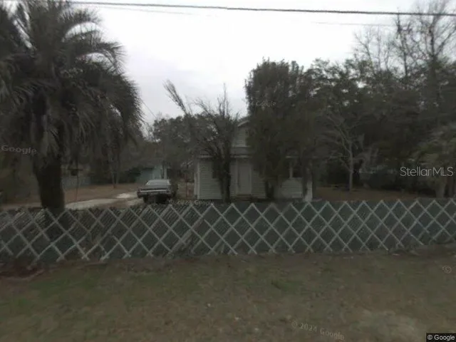 a couple of benches sitting next to a yard