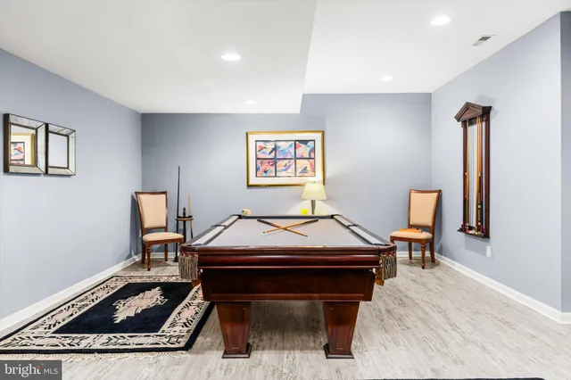 a room with a workspace and a window