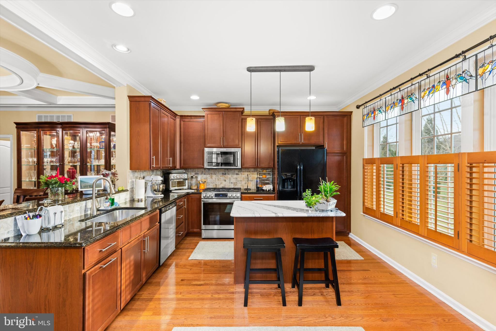 35224 Seaport Loop Lewes, DE 19958 - Photo 10 of 45 Elegant kitchen with rich wood accents.