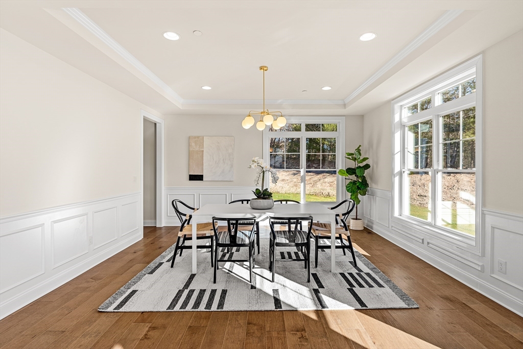24 Rookery Lane, Unit 6 Concord, MA 01742 - Photo 12 of 41 a view of a dining room with furniture window and wooden floor