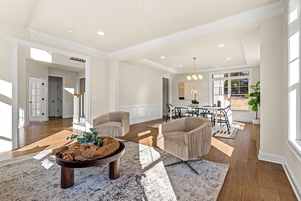 24 Rookery Lane, Unit 6 Concord, MA 01742 - Photo 13 of 41 a living room with furniture and a wooden floor