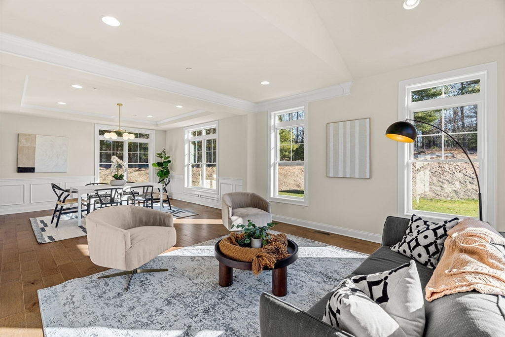 24 Rookery Lane, Unit 6 Concord, MA 01742 - Photo 14 of 41 a living room with furniture and a large window