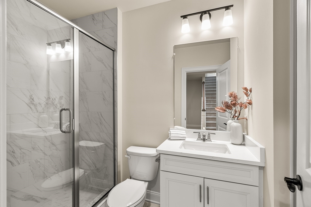 24 Rookery Lane, Unit 6 Concord, MA 01742 - Photo 17 of 41 a bathroom with a sink toilet and shower