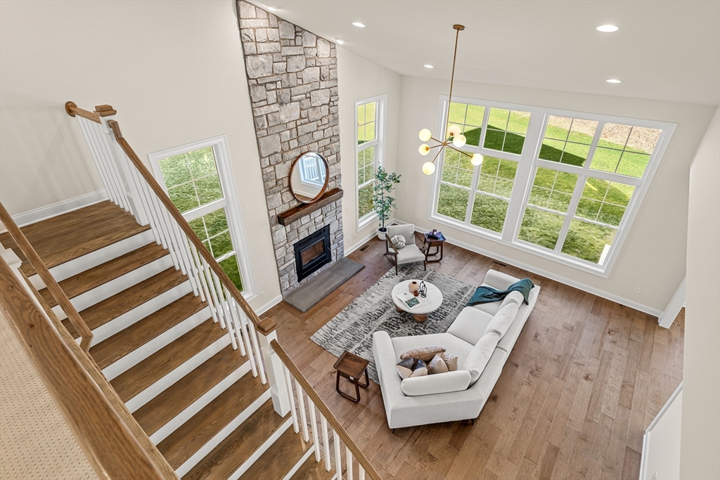 24 Rookery Lane, Unit 6 Concord, MA 01742 - Photo 18 of 41 a living room with furniture and a wooden floor