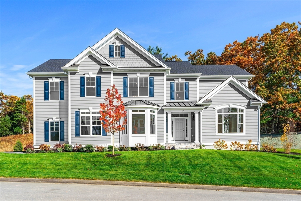24 Rookery Lane, Unit 6 Concord, MA 01742 - Photo 2 of 41 a front view of a house with a garden