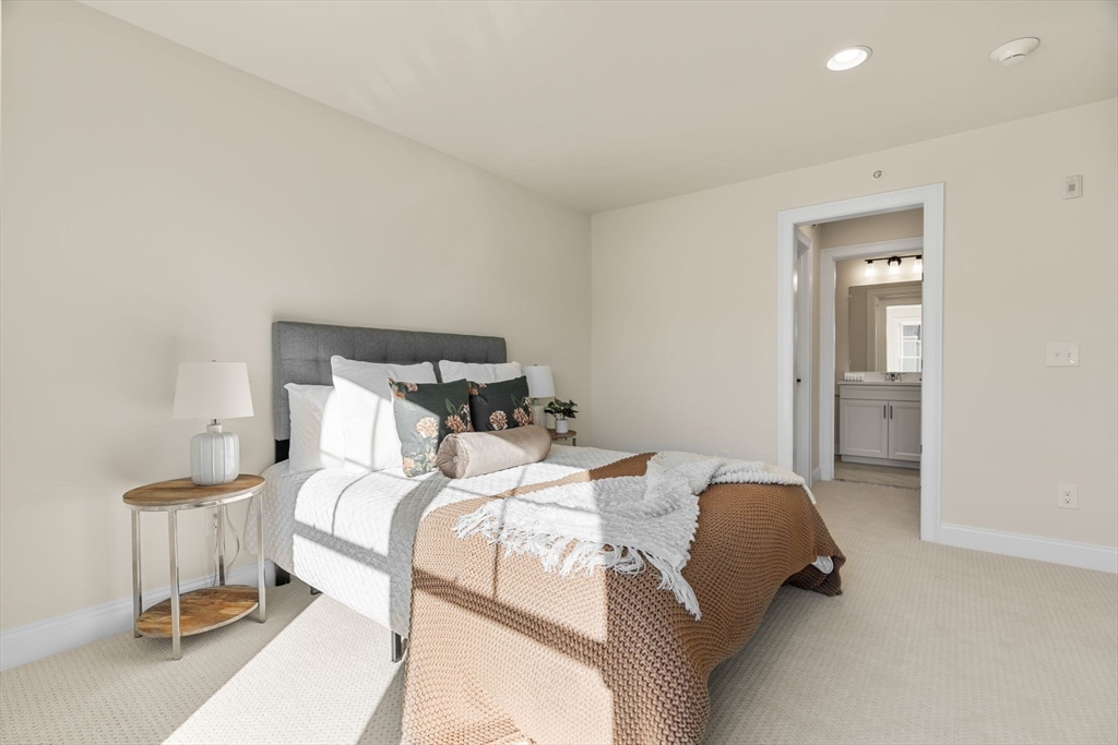 24 Rookery Lane, Unit 6 Concord, MA 01742 - Photo 21 of 41 a bedroom with a bed and closet