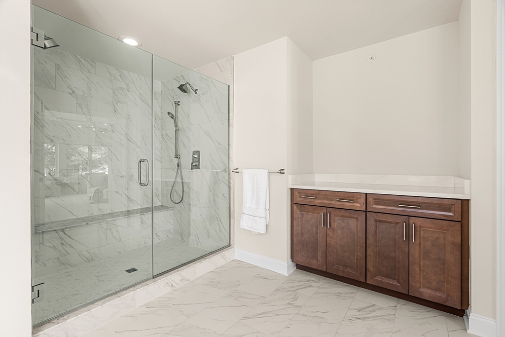 24 Rookery Lane, Unit 6 Concord, MA 01742 - Photo 26 of 41 a bathroom with a shower and a sink