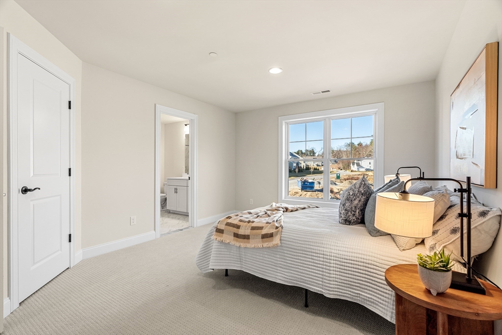 24 Rookery Lane, Unit 6 Concord, MA 01742 - Photo 29 of 41 a bedroom with bed and window