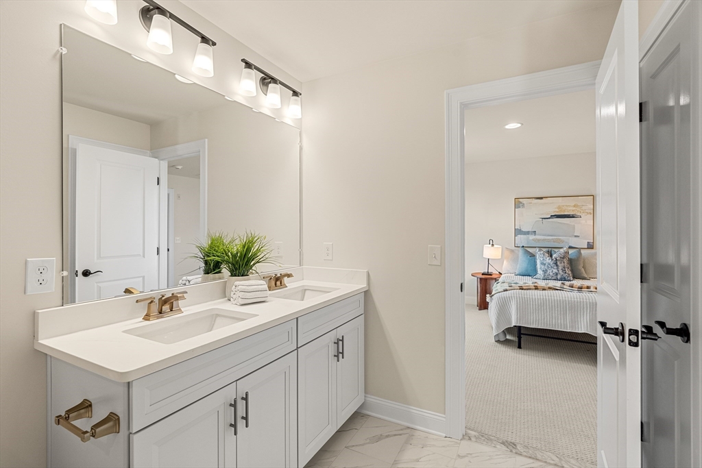 24 Rookery Lane, Unit 6 Concord, MA 01742 - Photo 30 of 41 a en suite bathroom with a sink double vanity and a mirror