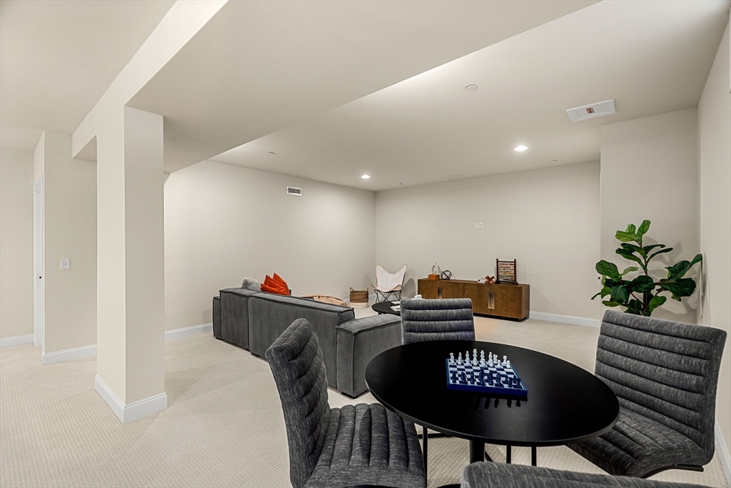 24 Rookery Lane, Unit 6 Concord, MA 01742 - Photo 33 of 41 a view of a dining room with furniture