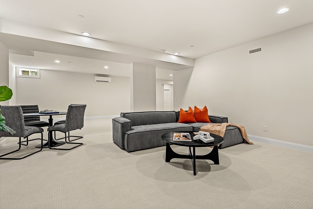 24 Rookery Lane, Unit 6 Concord, MA 01742 - Photo 34 of 41 a living room with furniture and a rug