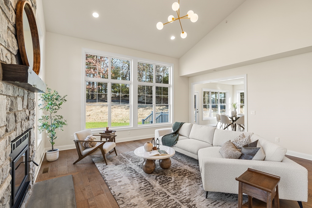 24 Rookery Lane, Unit 6 Concord, MA 01742 - Photo 9 of 41 a living room with furniture and a large window