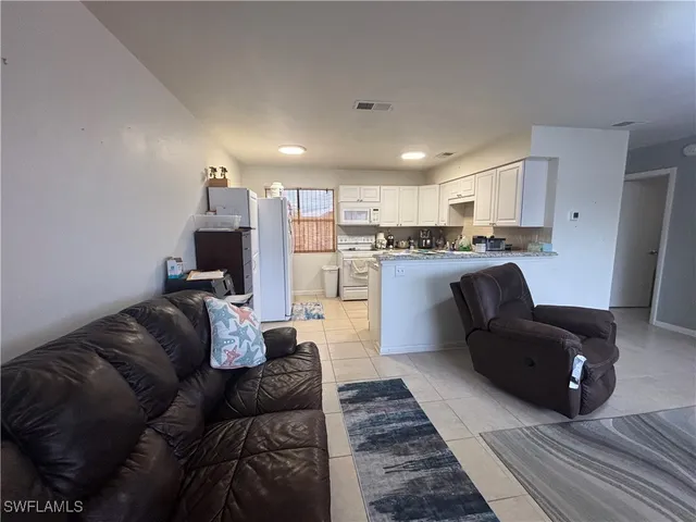 a living room with furniture and a couch