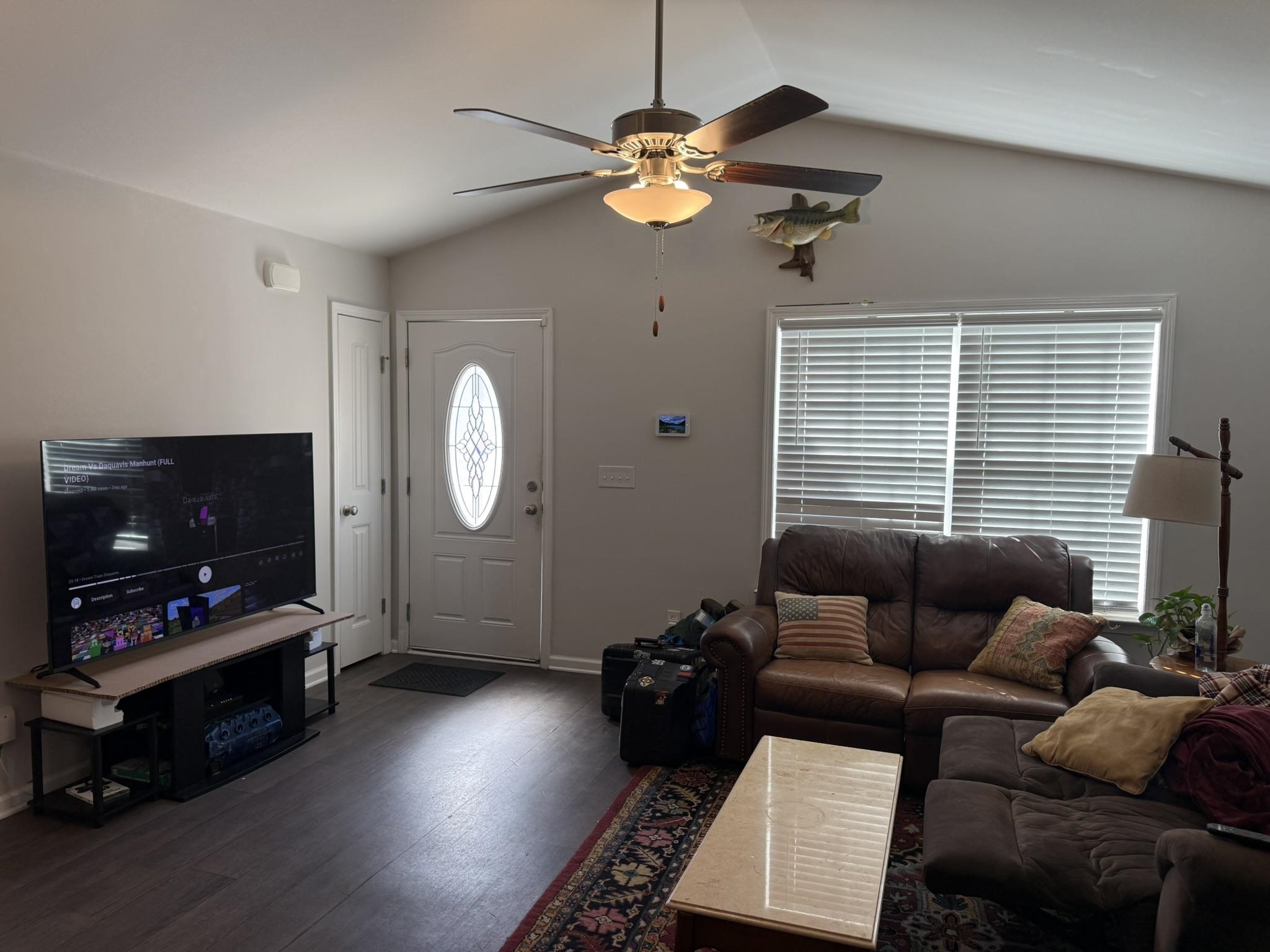 142 Desurrency Court Georgetown, SC 29440 - Photo 3 of 9 Living area with lofted ceiling, ceiling fan, and wood finished floors