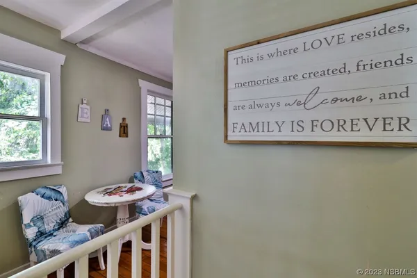 a kitchen with stainless steel appliances granite countertop a refrigerator a stove and a wooden floors