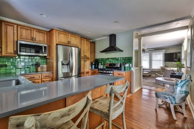 a spacious bedroom with a bed and a flat screen tv