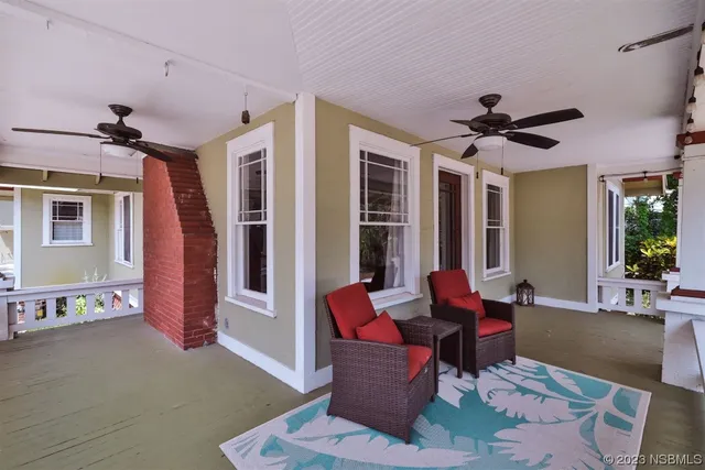 a living room with furniture fireplace and a flat screen tv