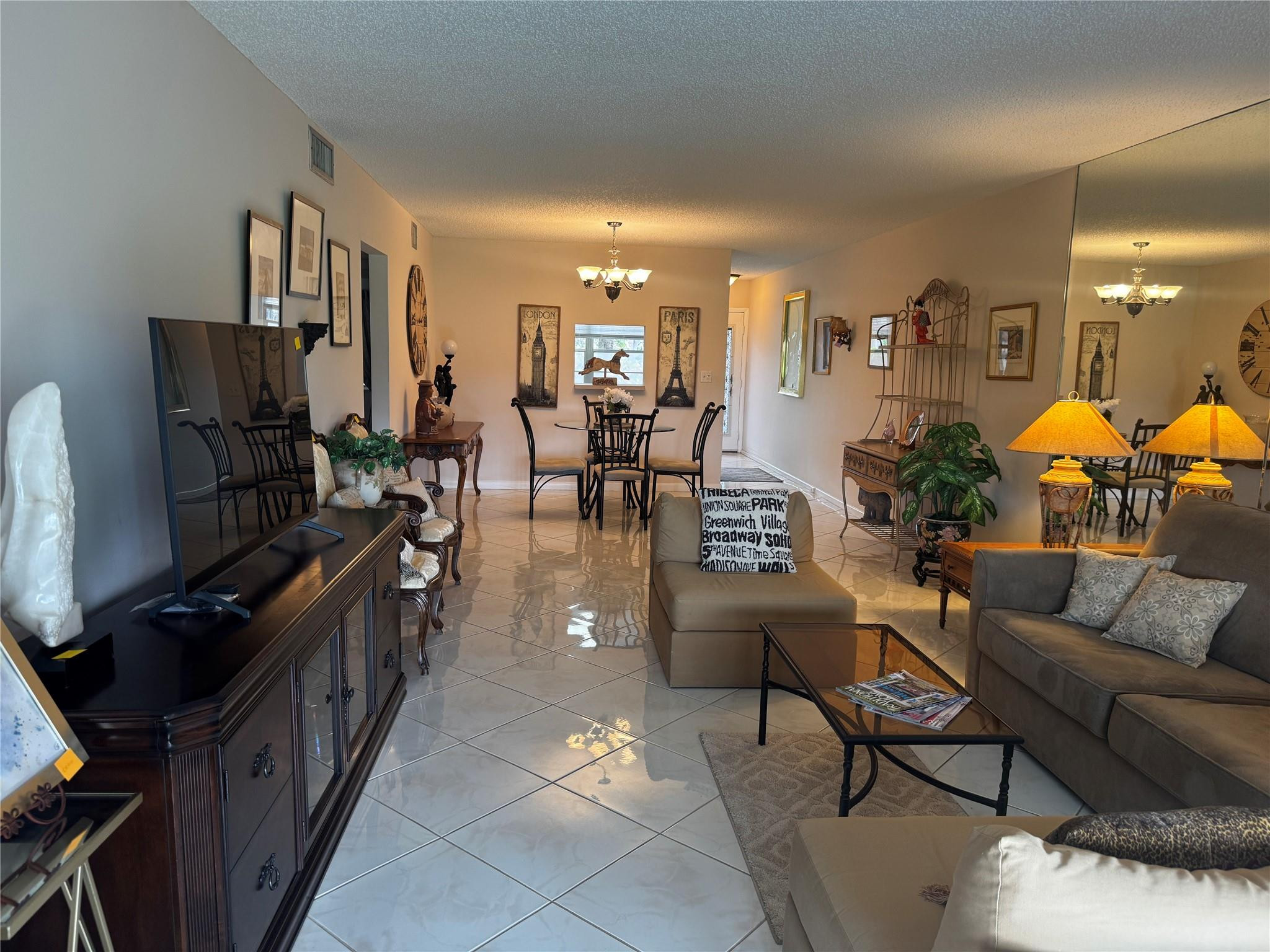 3302 Aruba Way, Unit M1 Coconut Creek, FL 33066 - Photo 11 of 58 a living room with furniture and a flat screen tv