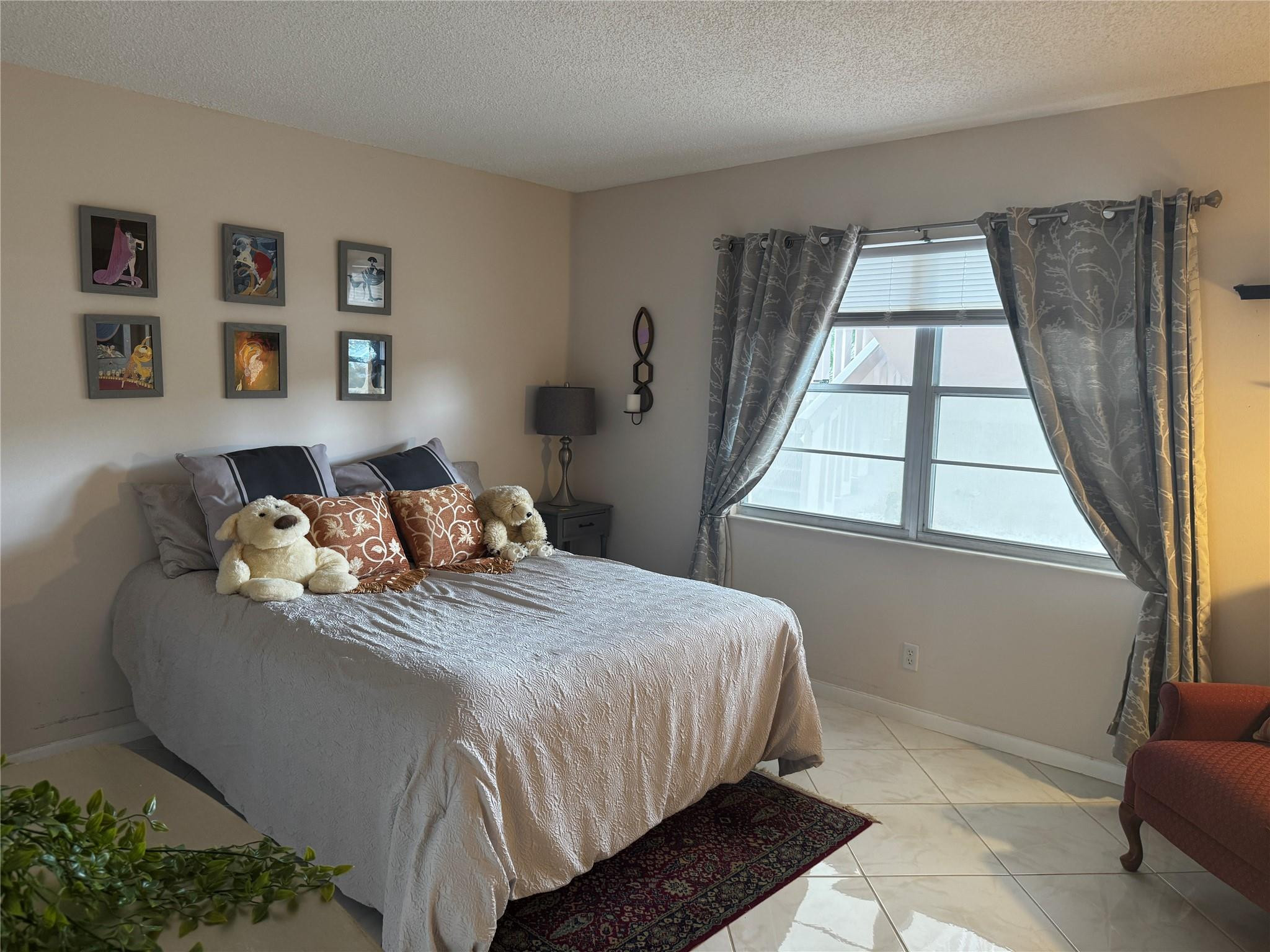 3302 Aruba Way, Unit M1 Coconut Creek, FL 33066 - Photo 14 of 58 a bedroom with bed and a window