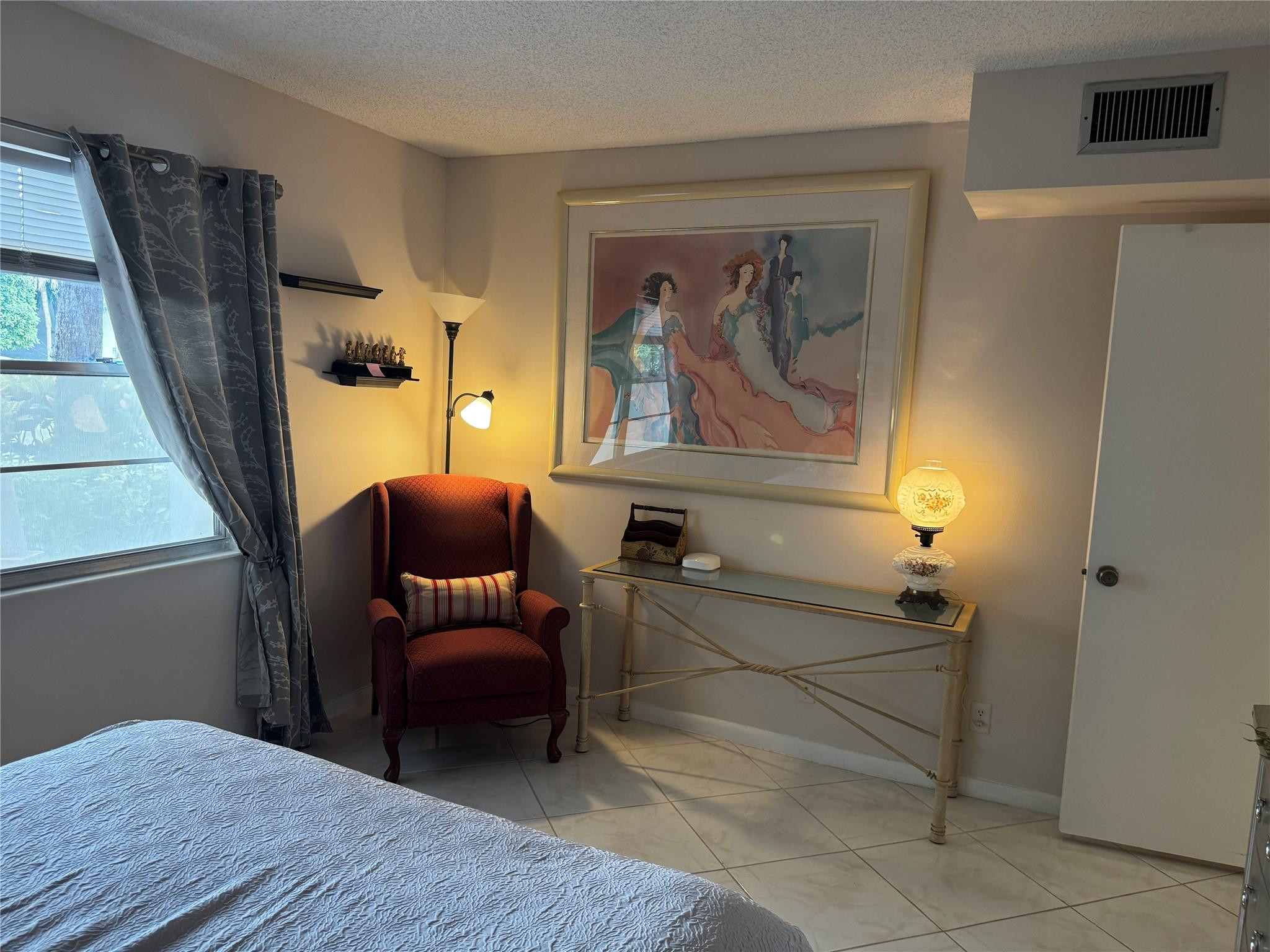 3302 Aruba Way, Unit M1 Coconut Creek, FL 33066 - Photo 15 of 58 a bedroom with furniture and a window