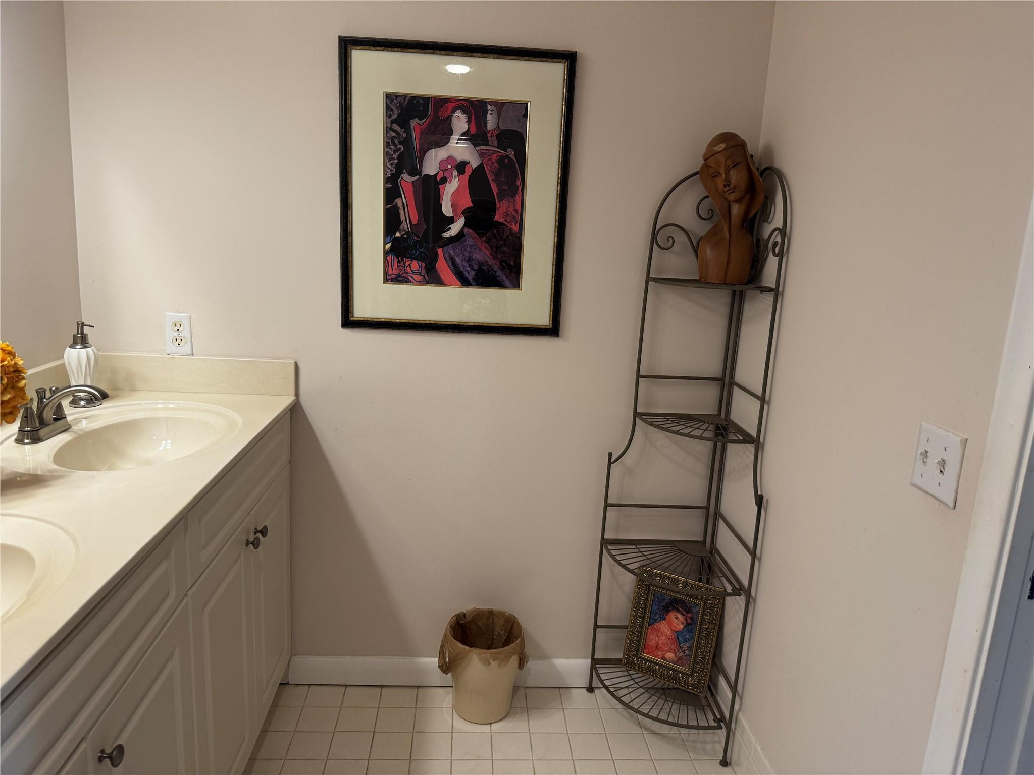 3302 Aruba Way, Unit M1 Coconut Creek, FL 33066 - Photo 21 of 58 a bathroom with a sink and a mirror