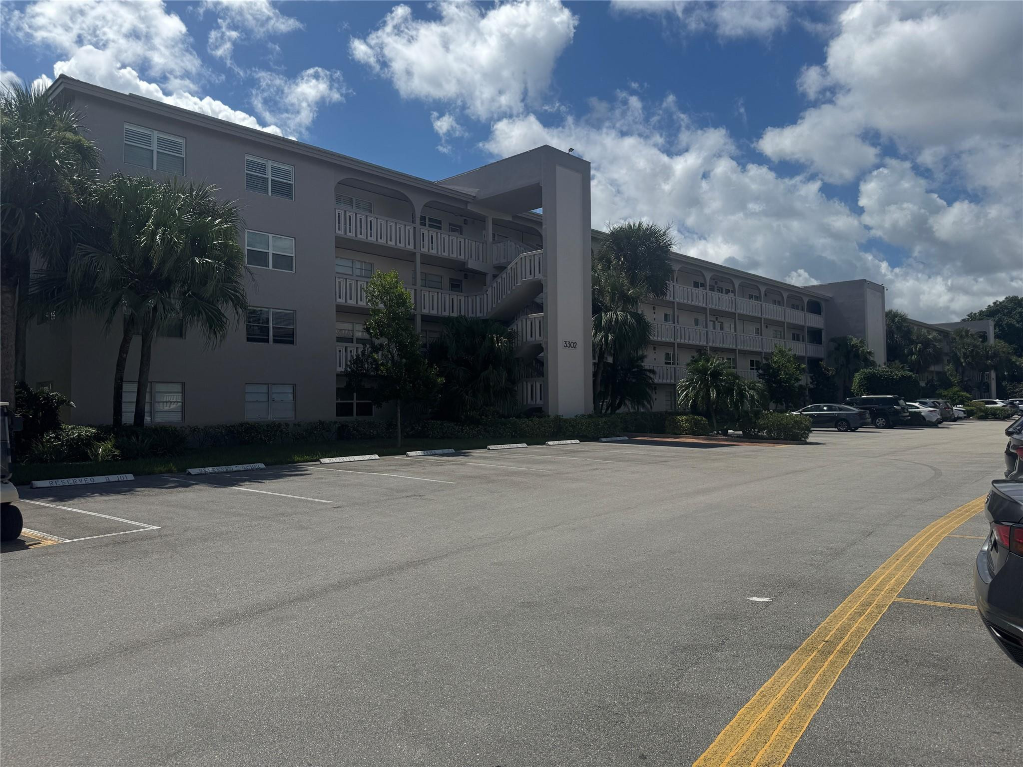 3302 Aruba Way, Unit M1 Coconut Creek, FL 33066 - Photo 27 of 58 a street view along with residential houses