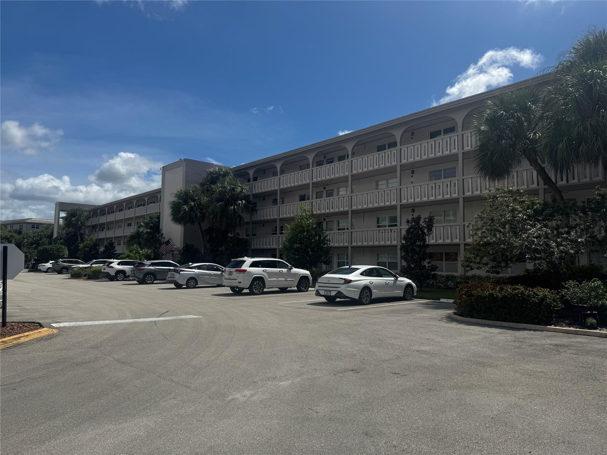 3302 Aruba Way, Unit M1 Coconut Creek, FL 33066 - Photo 28 of 58 a view of street with parked cars
