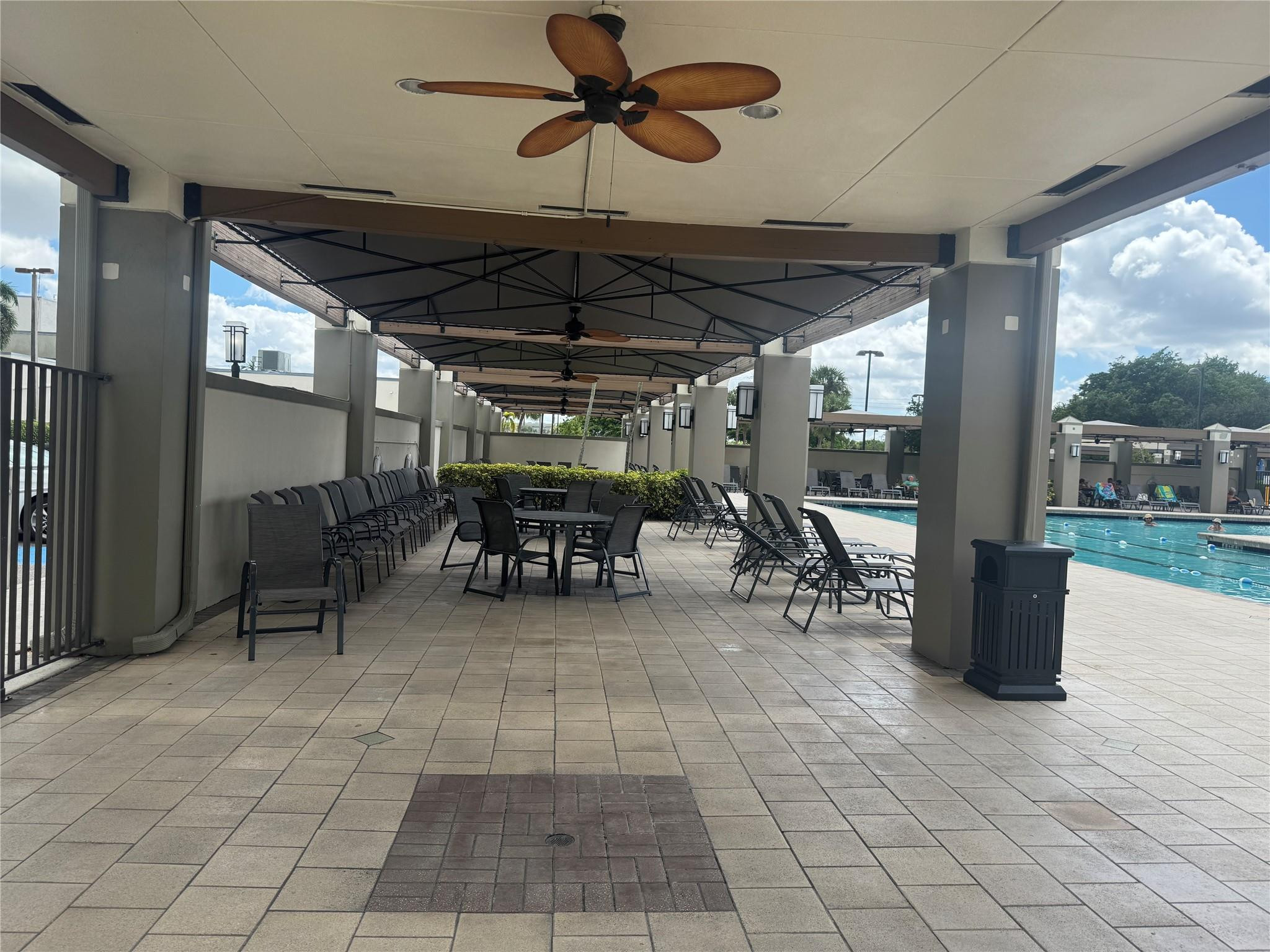 3302 Aruba Way, Unit M1 Coconut Creek, FL 33066 - Photo 29 of 58 a view of a patio with table and chairs