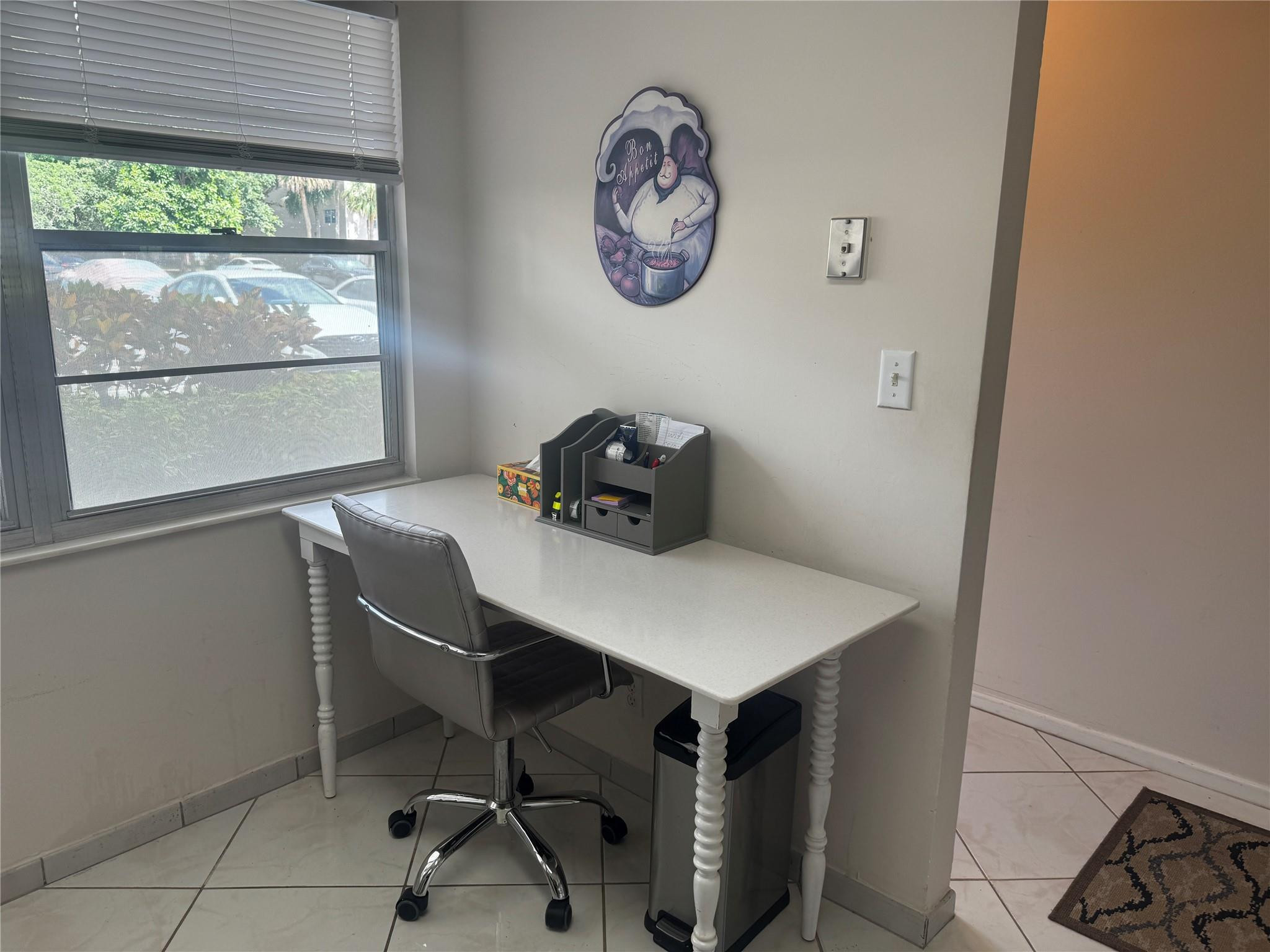 3302 Aruba Way, Unit M1 Coconut Creek, FL 33066 - Photo 3 of 58 a view of a workspace with furniture and a window