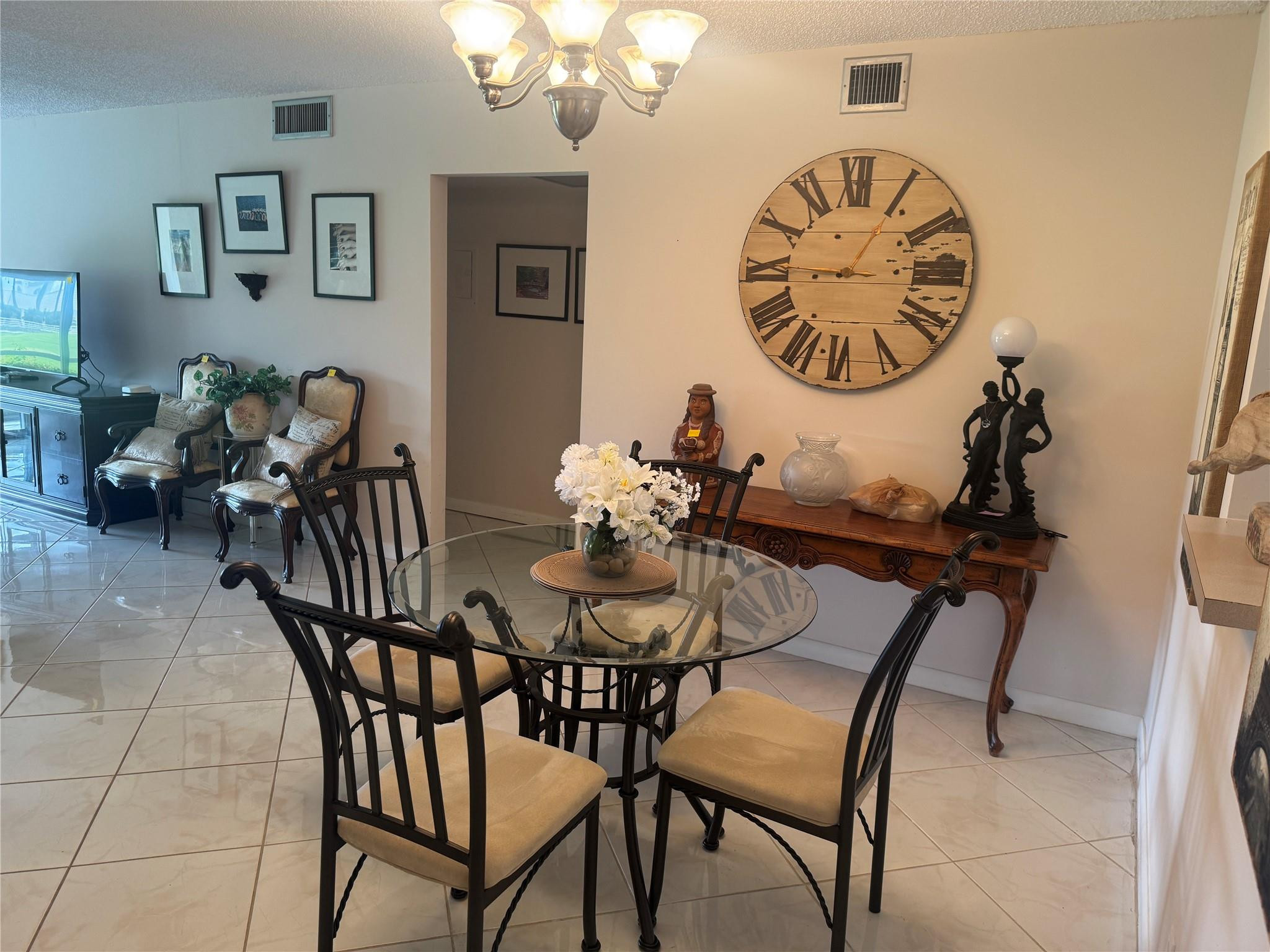 3302 Aruba Way, Unit M1 Coconut Creek, FL 33066 - Photo 4 of 58 a view of a dining room with furniture