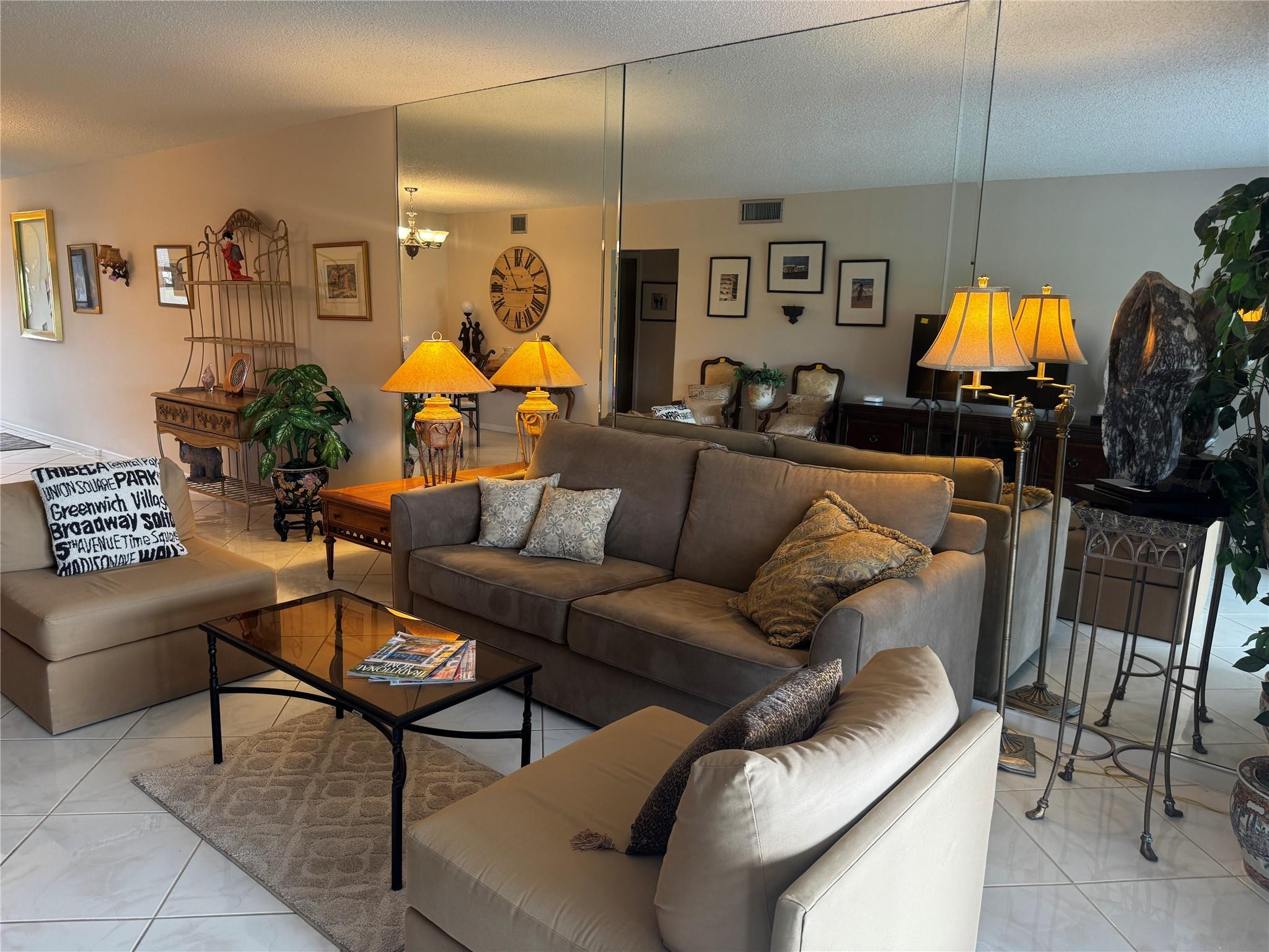 3302 Aruba Way, Unit M1 Coconut Creek, FL 33066 - Photo 6 of 58 a living room with furniture a lamp and a chandelier
