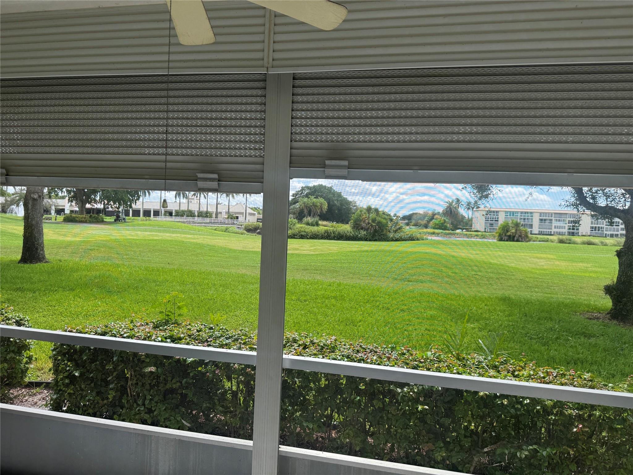 3302 Aruba Way, Unit M1 Coconut Creek, FL 33066 - Photo 9 of 58 a view of a back yard from a window