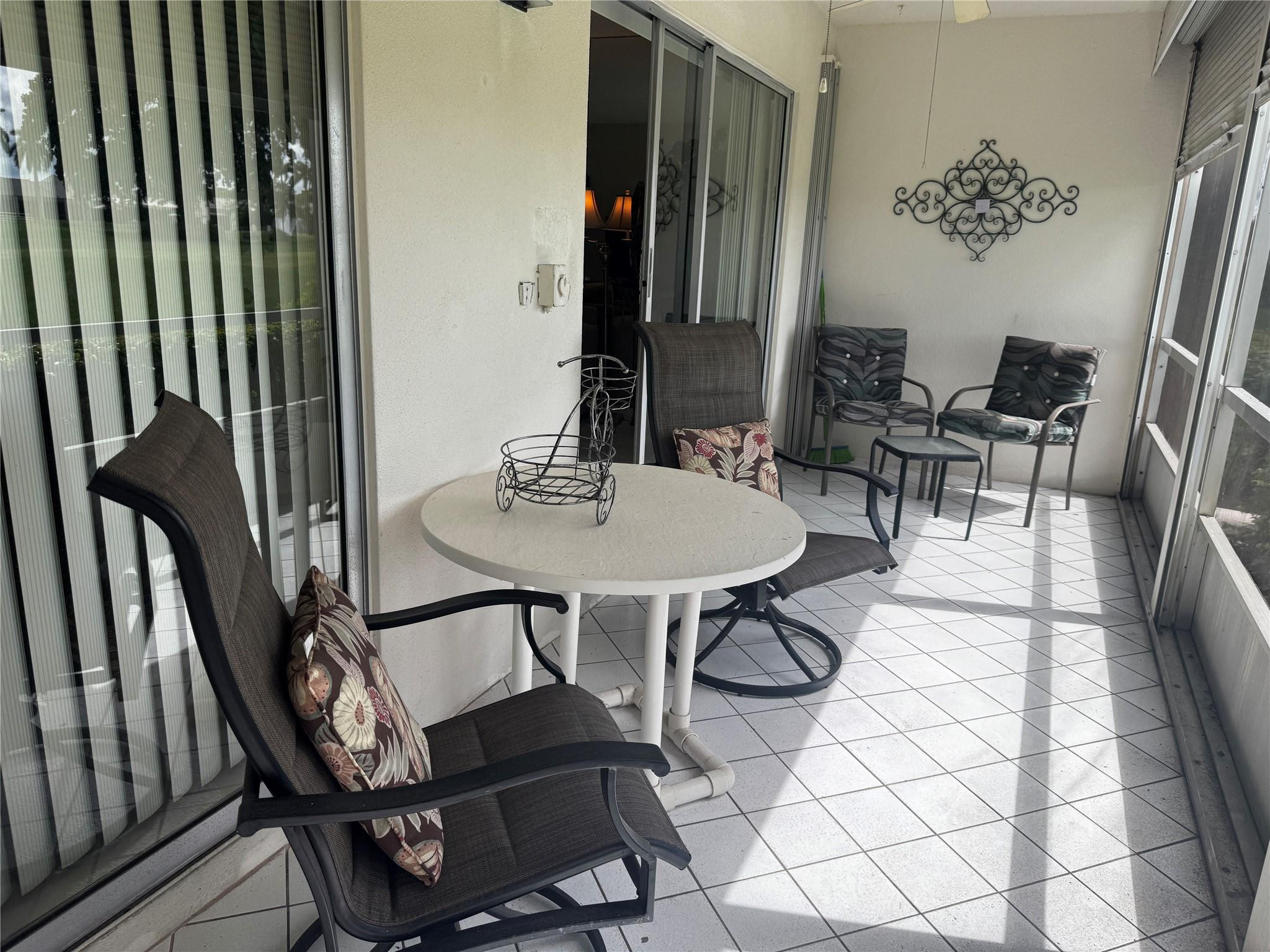 3302 Aruba Way, Unit M1 Coconut Creek, FL 33066 - Photo 10 of 58 a view of a livingroom with furniture and window