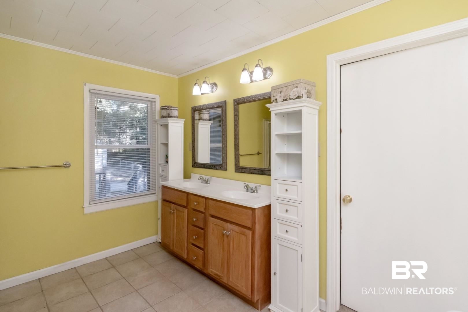 1321 Rainbow Drive West Mobile, AL 36693 - Photo 28 of 48 Bathroom featuring vanity, crown molding, and tile patterned flooring