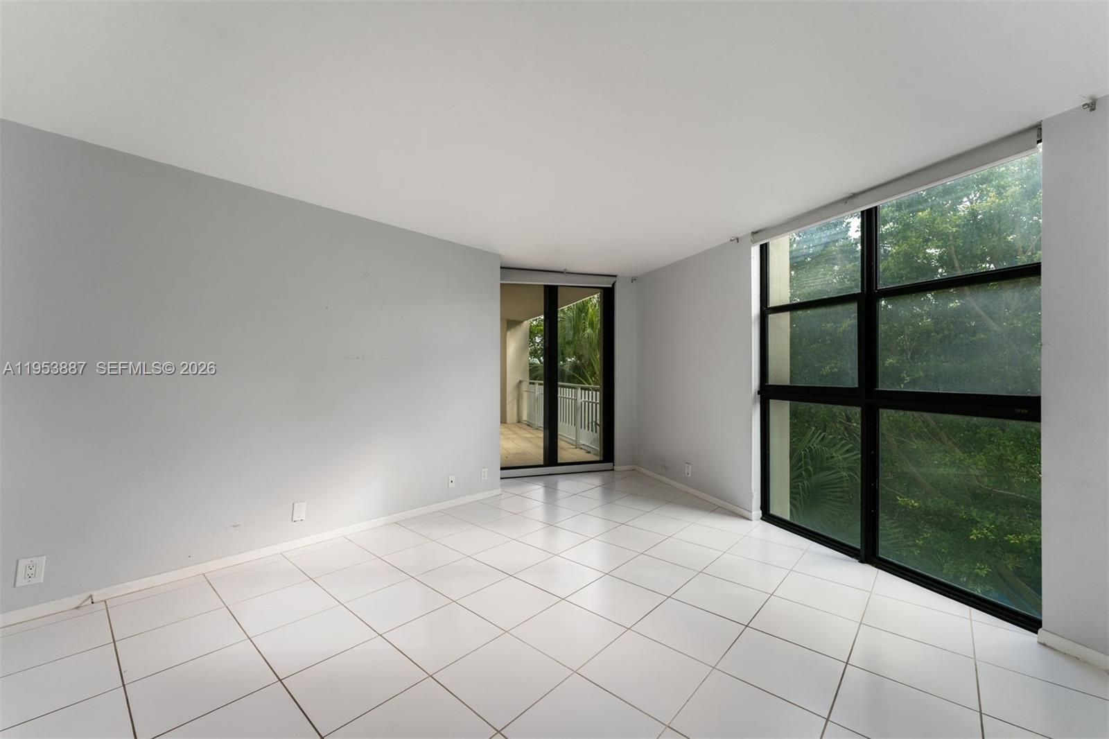 2000 Towerside Terrace, Unit 608 Miami, FL 33138 - Photo 18 of 44 a view of an empty room with windows