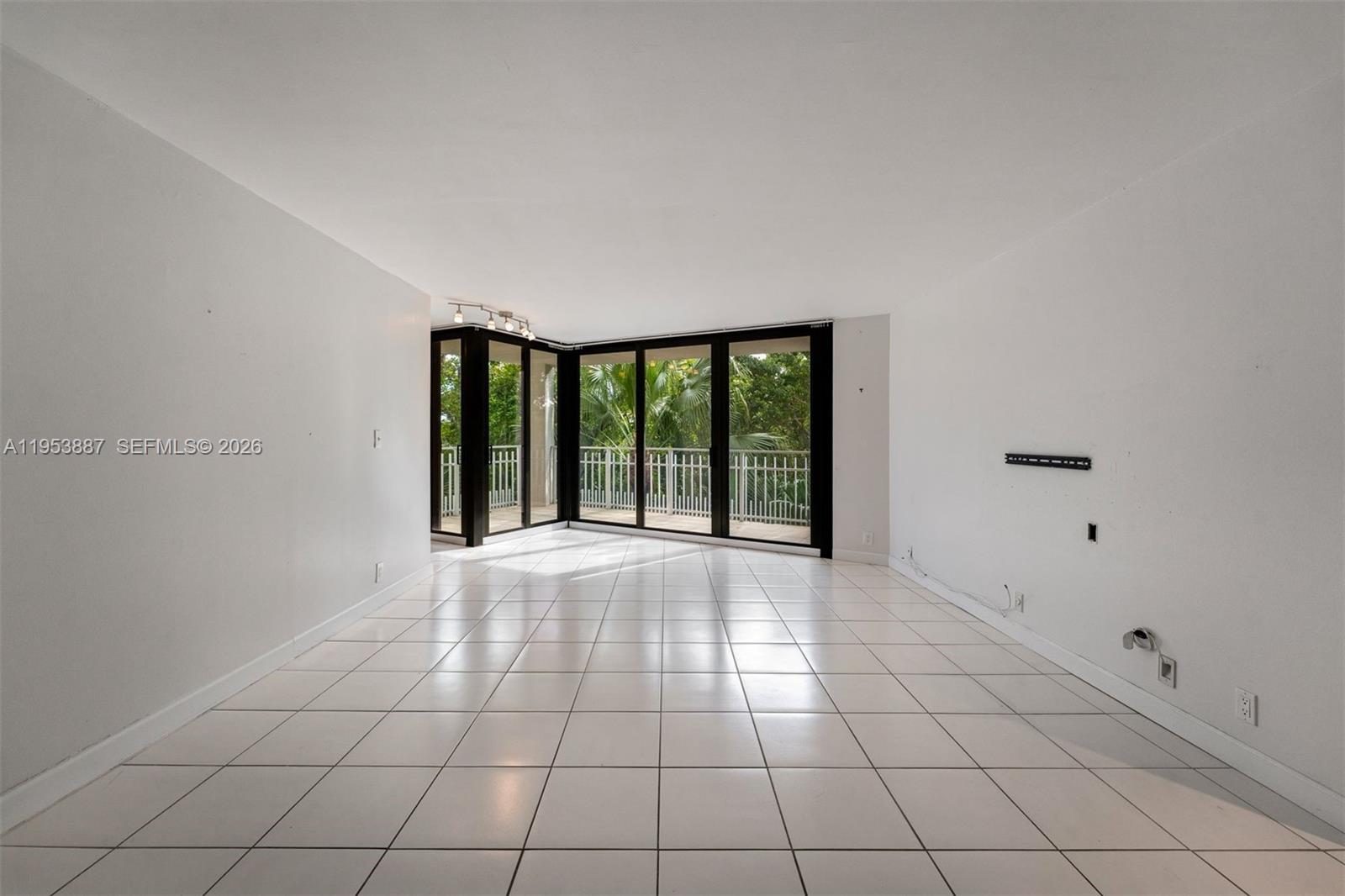 2000 Towerside Terrace, Unit 608 Miami, FL 33138 - Photo 2 of 44 a view of an empty room with a window