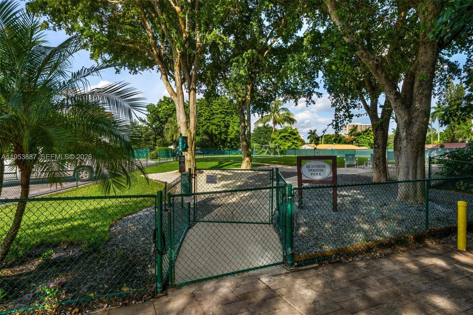 2000 Towerside Terrace, Unit 608 Miami, FL 33138 - Photo 26 of 44 a view of a park with plants and a bench