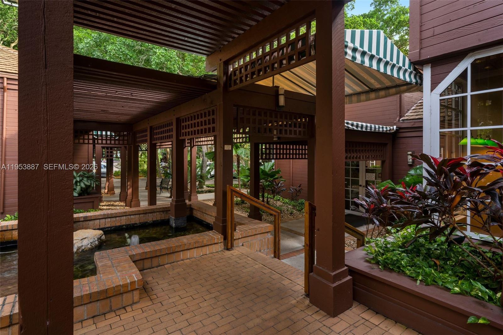 2000 Towerside Terrace, Unit 608 Miami, FL 33138 - Photo 27 of 44 a view of a house with a patio