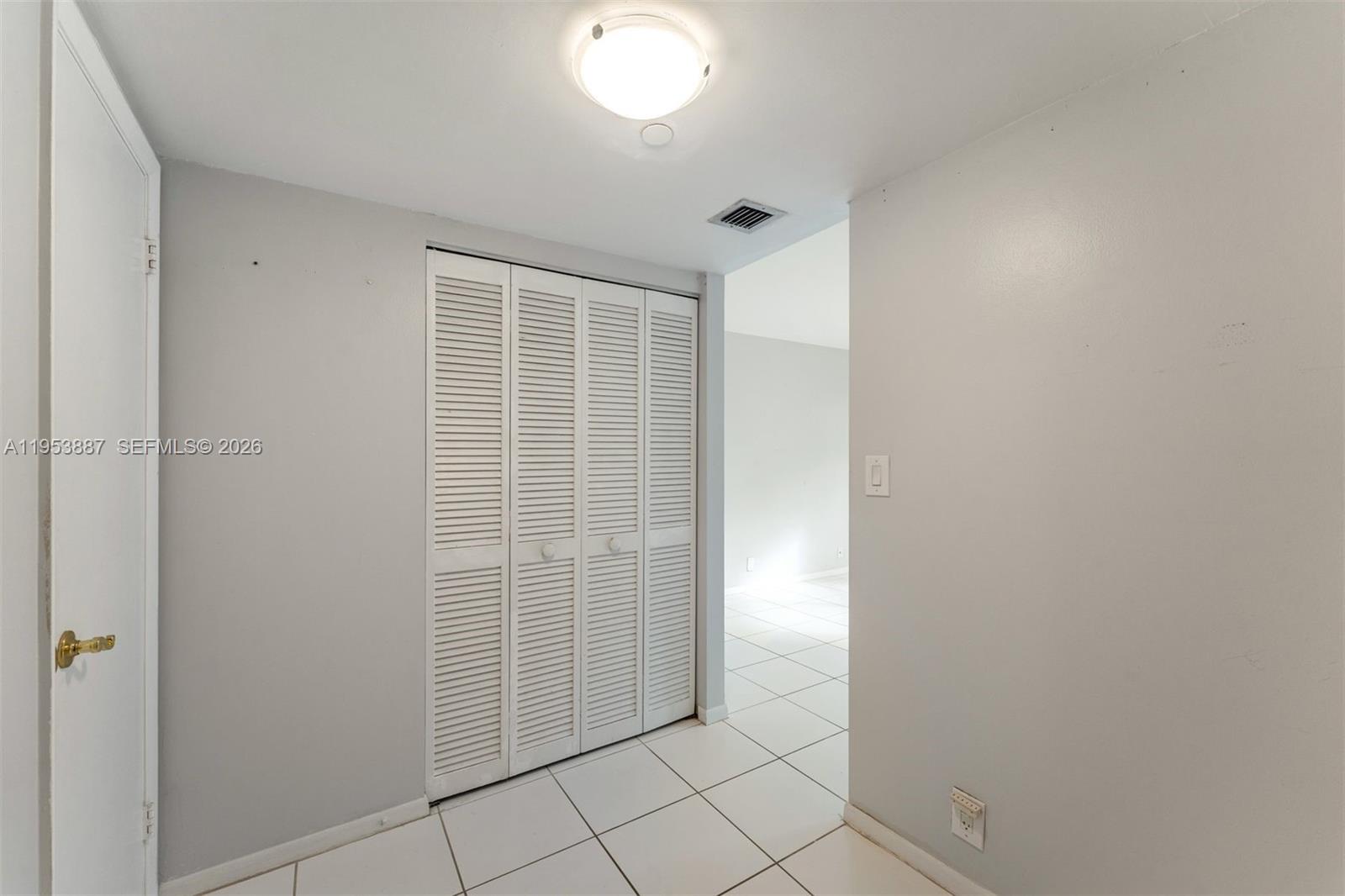 2000 Towerside Terrace, Unit 608 Miami, FL 33138 - Photo 5 of 44 an empty room with windows