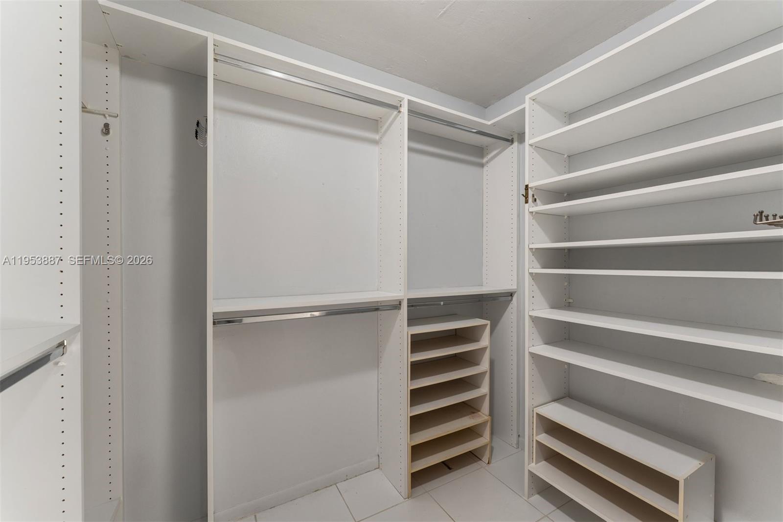 2000 Towerside Terrace, Unit 608 Miami, FL 33138 - Photo 6 of 44 a view of walk in closet with empty racks