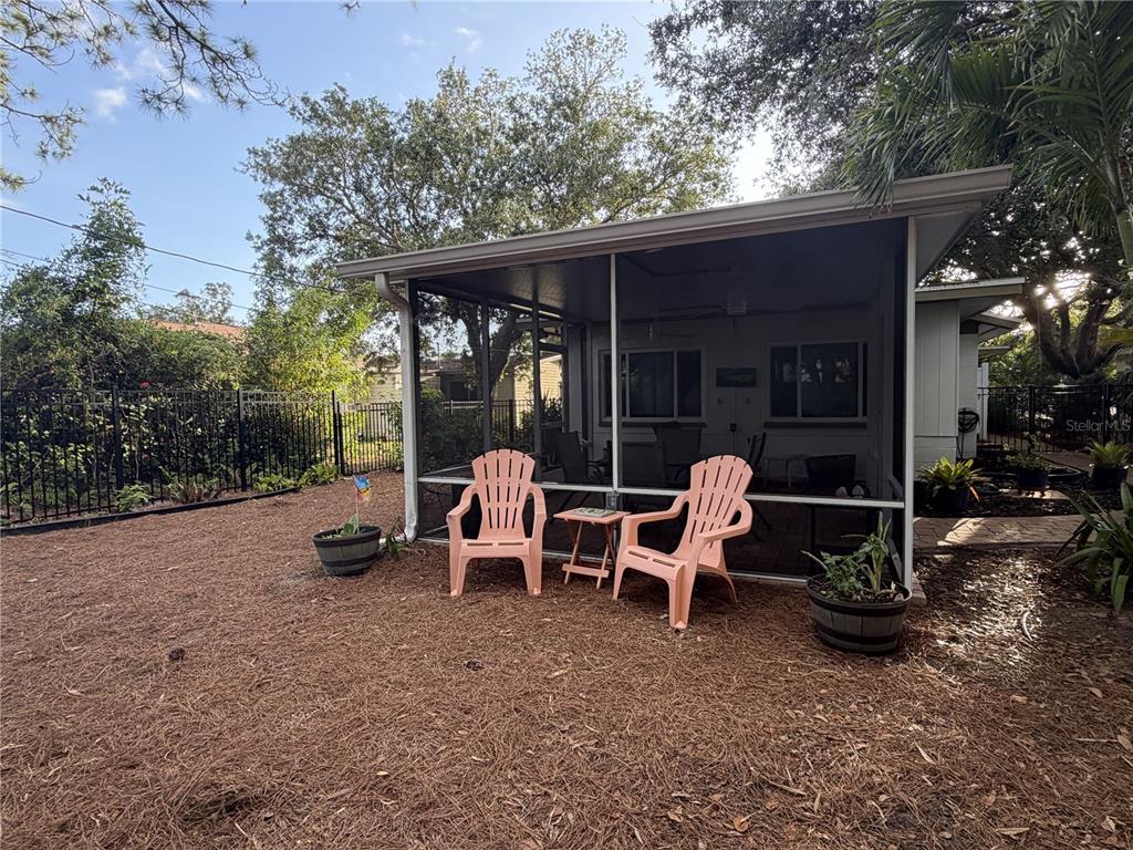 421 Riviera Street Venice, FL 34285 - Photo 21 of 30 a view of a patio with table and chairs and potted plants