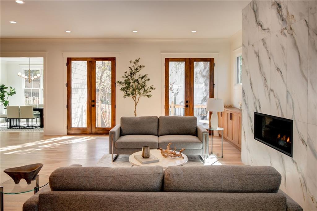 581 Sherwood Road Northeast Atlanta, GA 30324 - Photo 13 of 92 a living room with furniture and a fireplace