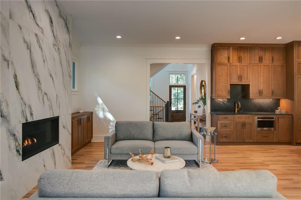 581 Sherwood Road Northeast Atlanta, GA 30324 - Photo 14 of 92 a living room with furniture and a fireplace
