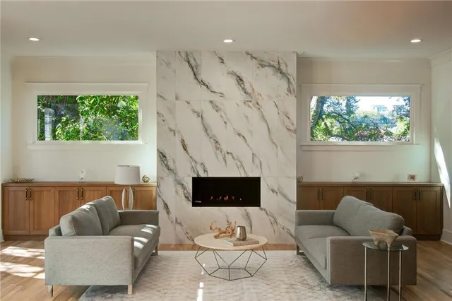 a view of balcony with furniture and a potted plant